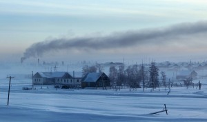 Smoke rises above houses in the village of Maralayi, in the Republic of Sakha