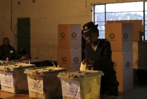 Police officer casts her vote at a polling station in Domboshava