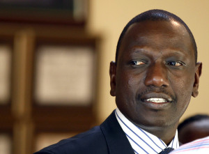 Former Kenyan Cabinet Minister Ruto stands inside his house after hearing the news from the International Criminal Court, in Nairobi