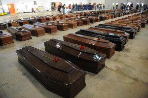 Coffin of victims are seen in an hangar of Lampedusa airport