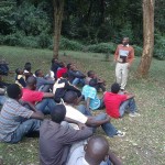 SOMI executive director addressing a group of youths brought there by their fathers, uncles and male guardians 