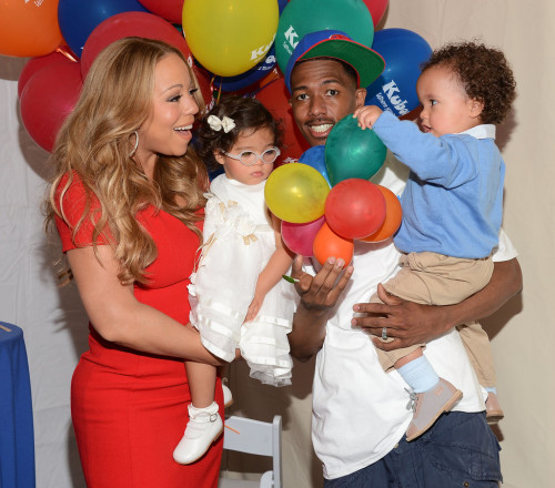 Mariah and Nick holding Monroe and Moroccan who were one-year-olds at the time