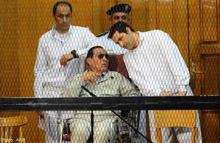 Frail former Egyptian president Hosni Mubarak and sons Gamal (left) and Alaa at a hearing in Cairo last September.