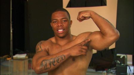 Rice shows off the guns he used to lay out his future wife!