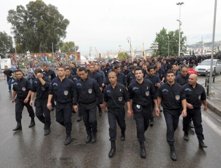 Police officers marched silently without weapons or protection to show solidarity with embattled colleagues