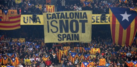The banner displays a popular refrain in Spain’s north-eastern corner