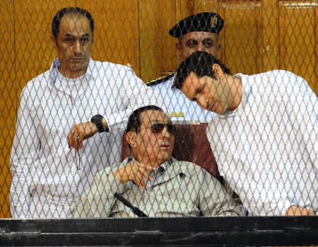Gamal (left) and Alaa Mubarak flank their father during last year’s trial
