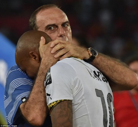Coach Avram Grant tries his best to console a sobbing Andre Ayew after Ghana’s heartbreaking sudden-death defeat