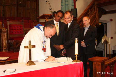 Maurice Tomlinson (centre left) received death threats in Jamaica following his same-sex marriage in Canada to Tom Decker, a police officer-cum-pastor in the Metropolitan Community Church of Toronto