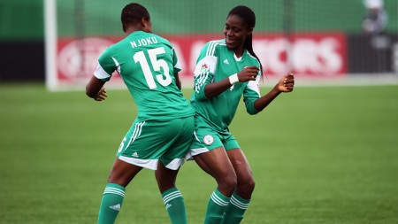 Nigeria’s Asisat Oshoala (r) celebrates scoring inside a minute with teammate Ugo Njoku in her team's 4 – 1 victory against New Zealand during the FIFA U-20 Women's World Cup 2014 Quarter Final
