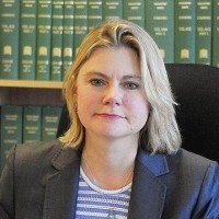 International Development Secretary Justine Greening said aid is not enough to eradicate poverty by itself