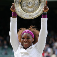 Serena Williams lifts the Venus Rosewater trophy for the sixth time