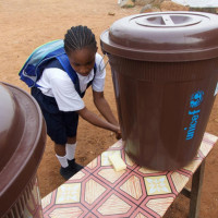 A girl washes her hands at the Slipway primary school in central Monrovia, the capital of Liberia. Photo credit: UNICEF/Irwin